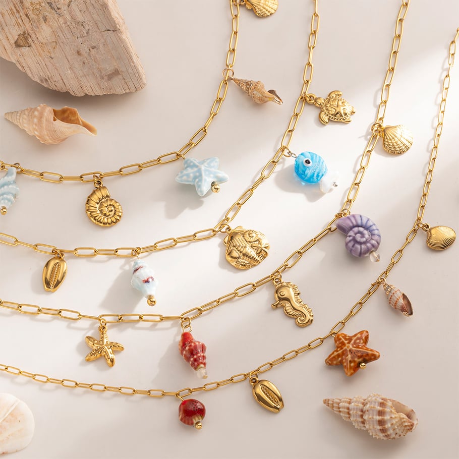 Bedelketting lichtblauwe zeester goud