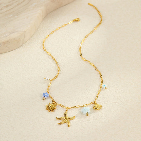 Bedelketting zeester met blauwe details goud