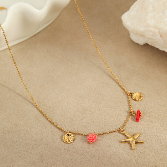 Bedelketting zeester roze/rood goud